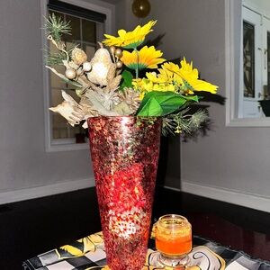 Red Speckled Glass Vase with Yellow Floral Arrangement